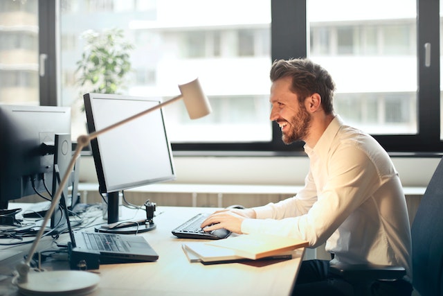 Happy man in office